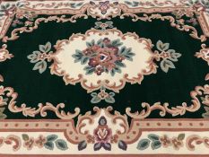 CHINESE WASHED MODERN RUG labelled 'Beijing', green and cream with floral design, 190 x 280cms
