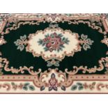 CHINESE WASHED MODERN RUG labelled 'Beijing', green and cream with floral design, 190 x 280cms