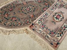 CHINESE WASHED RUGS (2) - oval, 175 x 115cms and oblong 145 x 60cms and another rug, 195 x 85cms