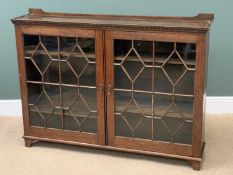 BOOKCASE CUPBOARD in polished oak with twin astragal glazed doors and dentil cornice, 106cms H,