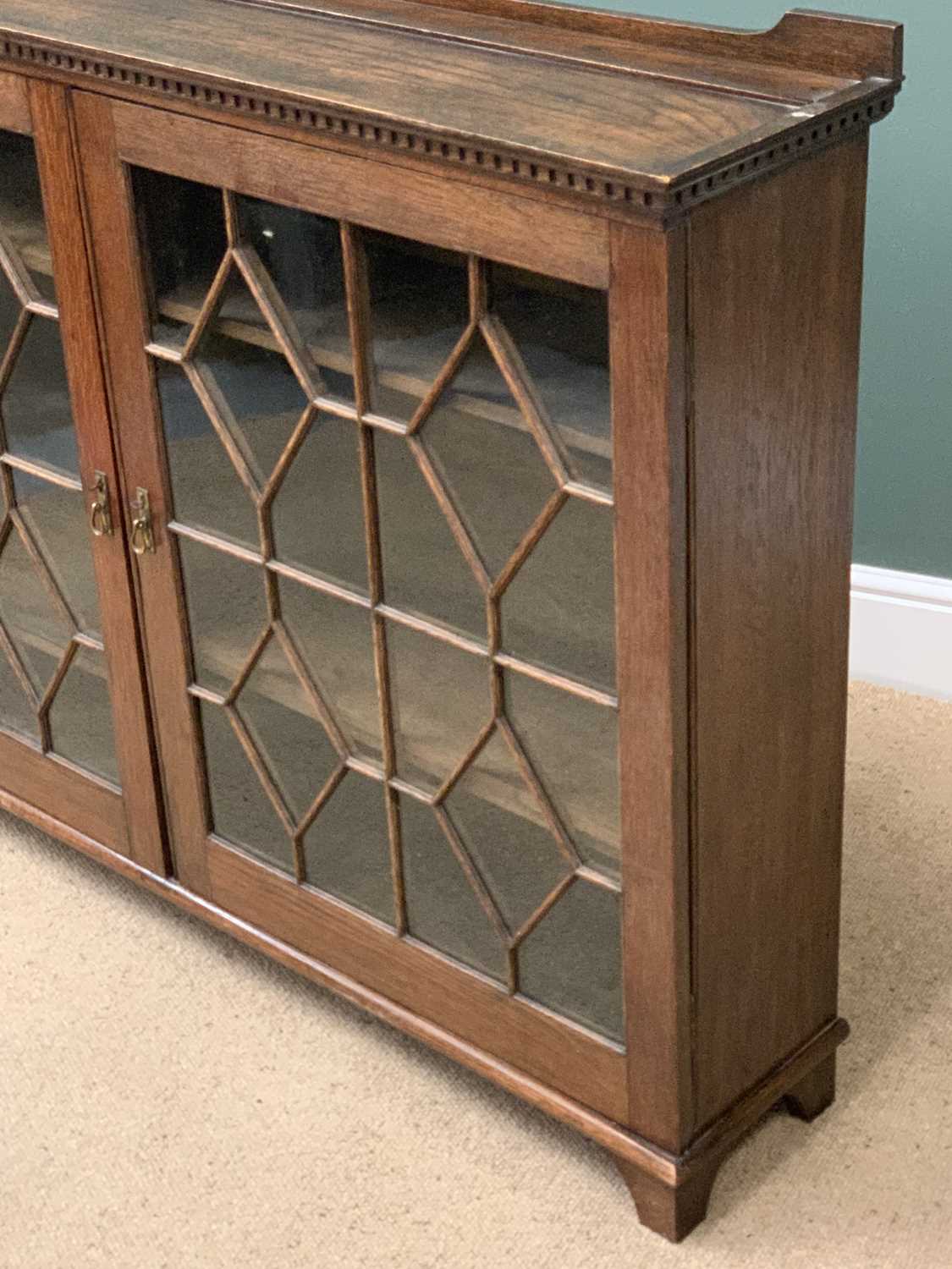 BOOKCASE CUPBOARD in polished oak with twin astragal glazed doors and dentil cornice, 106cms H, - Image 3 of 5