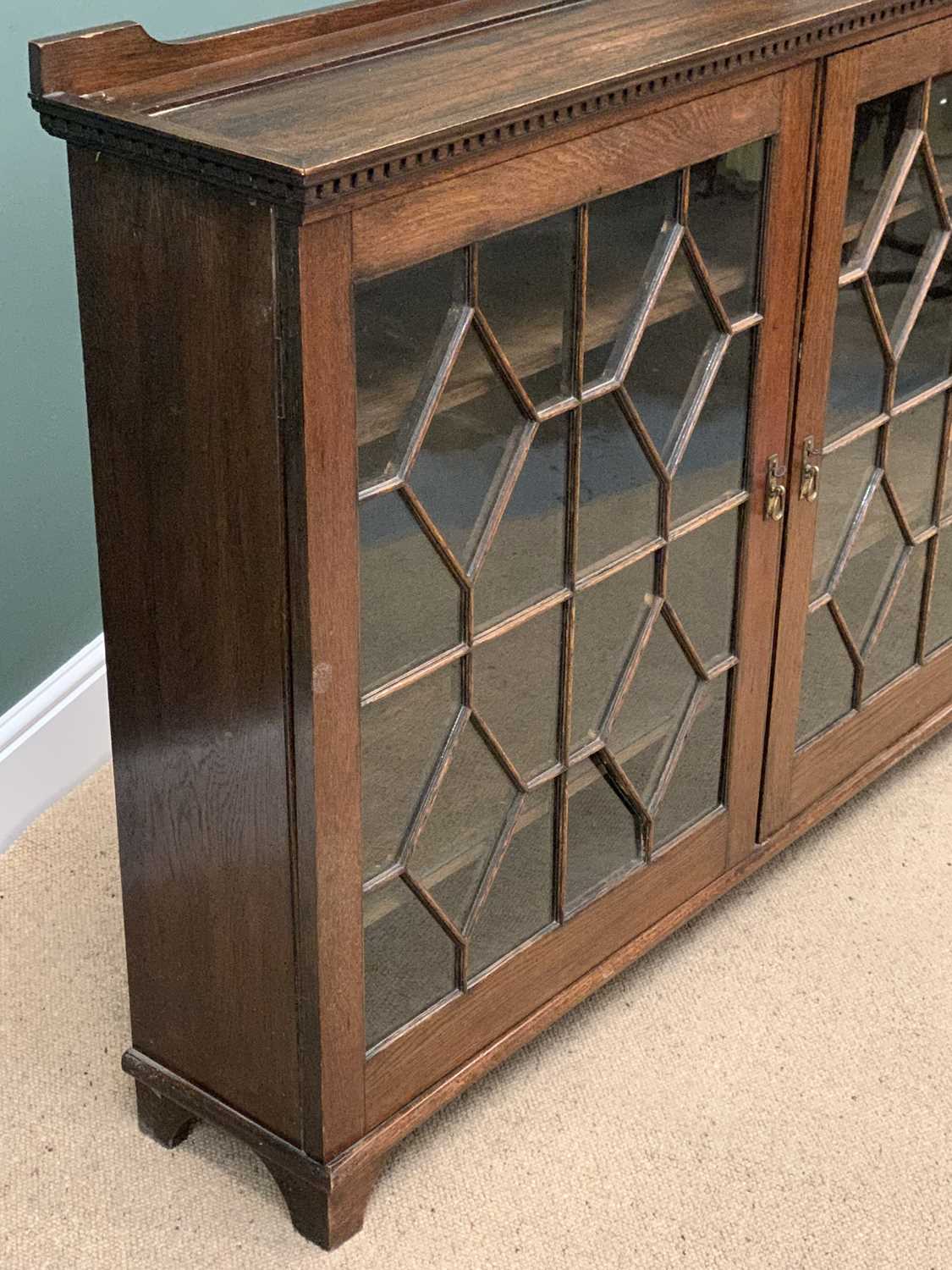 BOOKCASE CUPBOARD in polished oak with twin astragal glazed doors and dentil cornice, 106cms H, - Image 2 of 5