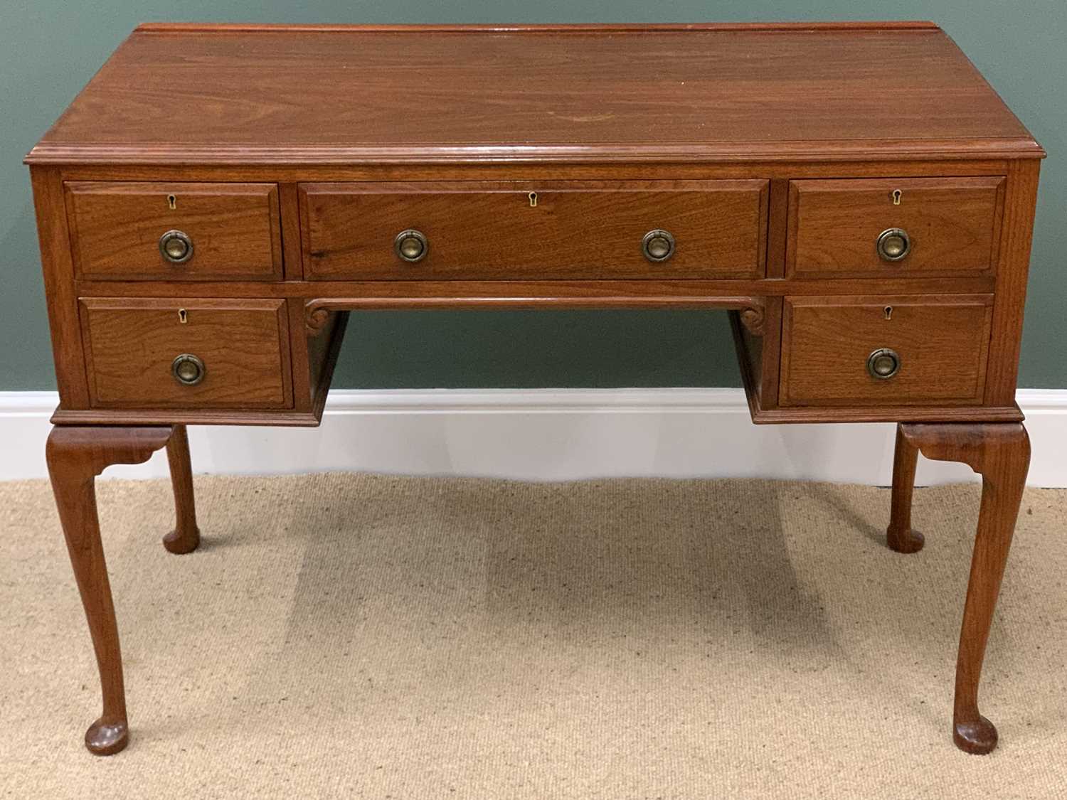 MAHOGANY KNEEHOLE DESK/DRESSING TABLE with central drawer and two small side drawers, on pad feet,