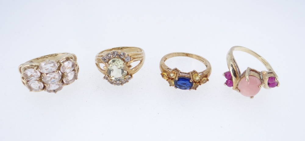 FOUR MODERN GOLD RINGS comprising 9K yellow gold pink opal & ruby ring, 9K yellow gold morganite