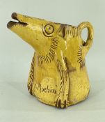 EWENNY POTTERY 'Y MOCHIN' SLIPWARE JUG, 20cms high Comments: handle broken away