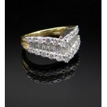 18CT GOLD DIAMOND ARROWHEAD RING, having three rows of round and baguette cut diamonds, ring size H,