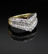 18CT GOLD DIAMOND ARROWHEAD RING, having three rows of round and baguette cut diamonds, ring size H,