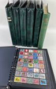 STAMPS: ALL WORLD COLLECTION IN SIX GREEN STOCK ALBUMS, mint and cancelled, mid 20th C and later,