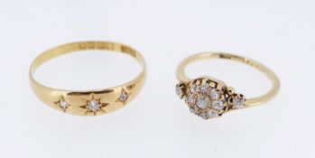 TWO 18CT GOLD DIAMOND RINGS comprising three stone gypsy example and a cluster example, 4.8gms
