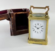 GILT BRASS CORNICHE CASE CARRIAGE CLOCK, late 19th Century, with original travelling case, the