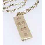 9CT GOLD INGOT PENDANT on fine 9ct gold oval link chain, 38.5cms long, 37.9gms overall Provenance: