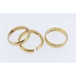 THREE GOLD RINGS comprising two 22ct gold wedding bands (7.4gms) and an 18ct gold wedding band (2.