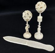 TWO CHINESE IVORY PUZZLE BALLS & PAGE TURNER, with sectional stands, one with monkey holding a