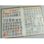 STAMPS: Slim brown stock book partially filled, containing interesting used collection of Queen