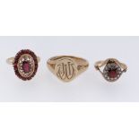 THREE 9CT GOLD RINGS comprising engraved signet ring and two 9ct gold semi-precious cluster rings,