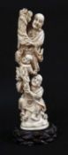 JAPANESE MARINE IVORY OKIMONO OF TWO MEN AND A BOY, signed Hakumitsu, Meiji Period