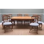 FRENCH OAK DINING SUITE, draw leaf dining table with parquet top, on shaped apron and Rococo