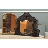 THREE DECORATIVE MIRRORS, including Rococo style ebonised overmantel with five demilune china