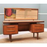 VICTOR. B. WILKINS FOR G-PLAN: Teak 'Fresco' dressing table, with mirror back, 'hovering' top over 4