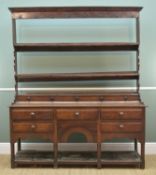 GEORGE III OAK WELSH DRESSER, angled cornice to the open rack with shaped lower sides, above row