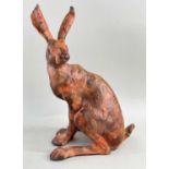 ‡ PAUL JENKINS SCULPTURE OF A HARE, pottery, signed with initials, 29cms h.