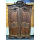 19TH CENTURY PROVINCIAL FRENCH OAK ARMOIRE, probably Normandy, carved C-scroll cornice with high