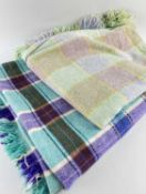TWO TRADITIONAL WOOLLEN BLANKETS, one purple, brown and green plaid, 168 x 420cms (small tear),