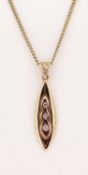 9CT WELSH GOLD NECK CHAIN with pear shaped pendant and three small, possibly diamonds, 5grms