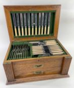 EDWARDIAN OAK-CASED PLATED CANTEEN, H M N Humphrey & Co, Sheffield, of flatware and cutlery,