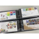 STAMPS: two books of FDCs from 15 Jan 2002 to 10 Jan 2006; and 23 Feb 2006 to 6 Nov 2007, with