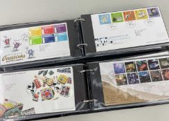 STAMPS: two books of FDCs from 15 Jan 2002 to 10 Jan 2006; and 23 Feb 2006 to 6 Nov 2007, with