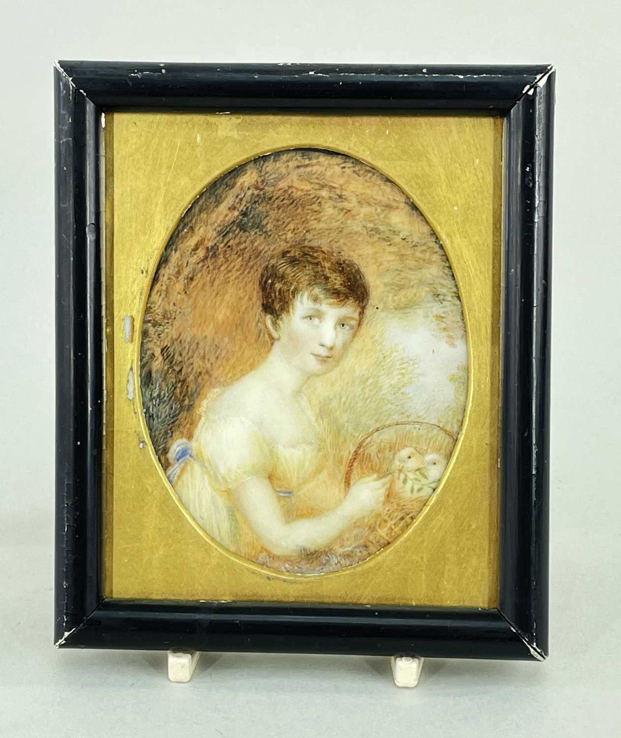 EARLY 19TH CENTURY PORTRAIT MINIATURE OF A GIRL, feeding a pair of doves in a basket, 10 x 8cm