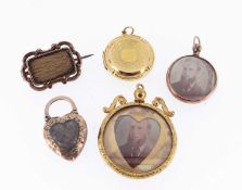 ASSORTED MOURNING JEWELLERY comprising mid-19th century yellow metal bar brooch with scroll border
