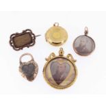 ASSORTED MOURNING JEWELLERY comprising mid-19th century yellow metal bar brooch with scroll border