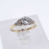 18CT GOLD & PLATINUM DIAMOND RING, the central stone measuring 0.33cts approx. flanked by diamond