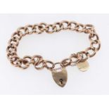 9CT GOLD CURB LINK BRACELET, having heart shaped padlock and 9ct gold circular pendant, 11.8gms