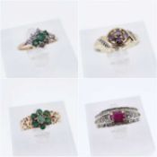 FOUR 9CT GOLD GEM SET RINGS comprising emerald cluster ring, emerald and diamond ring, ruby and