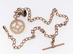 9CT GOLD CURB LINK WATCH CHAIN, having T-bar, small brass seal attachment (lacking insert) and 9ct