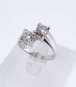 18CT WHITE GOLD TWO STONE DIAMOND CROSSOVER RING, the two round brilliant cut stones 0.9-1.0cts