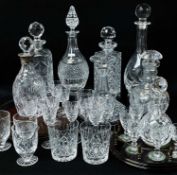 ASSORTED CUT GLASS DECANTERS & TABLE GLASS, including six decanters, two liqueur sets on wood trays,