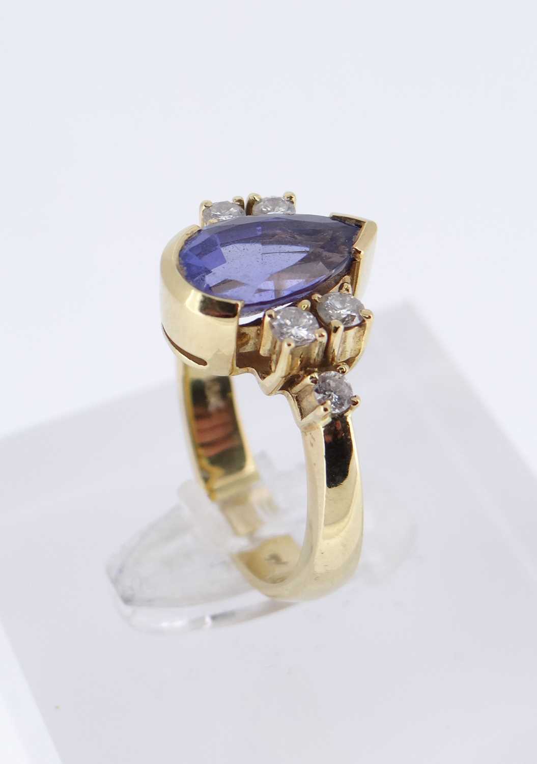 18K GOLD TANZANITE & DIAMOND RING, the central pear shaped tanzanite flanked by three diamonds - Image 4 of 4