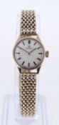 OMEGA LADIES 9CT GOLD WRISTWATCH, the circular dial with baton markers, numbered to inner back cover