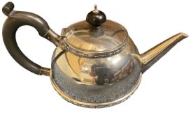 SILVER TEAPOT - Birmingham 1945, 11.9ozt with ebonised handle and lid finial, 24cms across