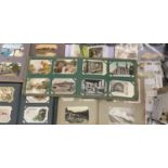 VINTAGE POSTCARD & CIGARETTE CARD COLLECTION - in four albums and loose, approximately 700 postcards