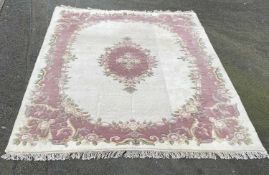 CHINESE WASHED CARPET - floral patterned in pink and cream with tasselled ends, 2.4m x 3.4m