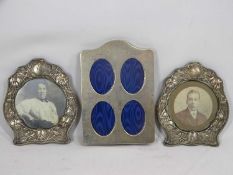 THREE HALLMARKED SILVER PHOTOGRAPH FRAMES to include a pair of shaped examples, embossed with