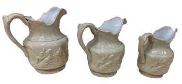 VICTORIAN RELIEF MOULDED JUGS - a graduated set of three, 19cms H the tallest
