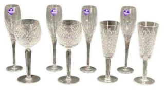 WATERFORD CRYSTAL DRINKING GLASSWARE - a boxed pair of hock glasses and a boxed pair of champagne