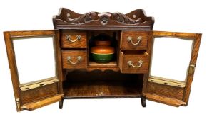 VINTAGE OAK TWO DOOR PIPE SMOKER'S CABINET - having a pottery tobacco jar, 46cms H, 41cms W, 18.5cms