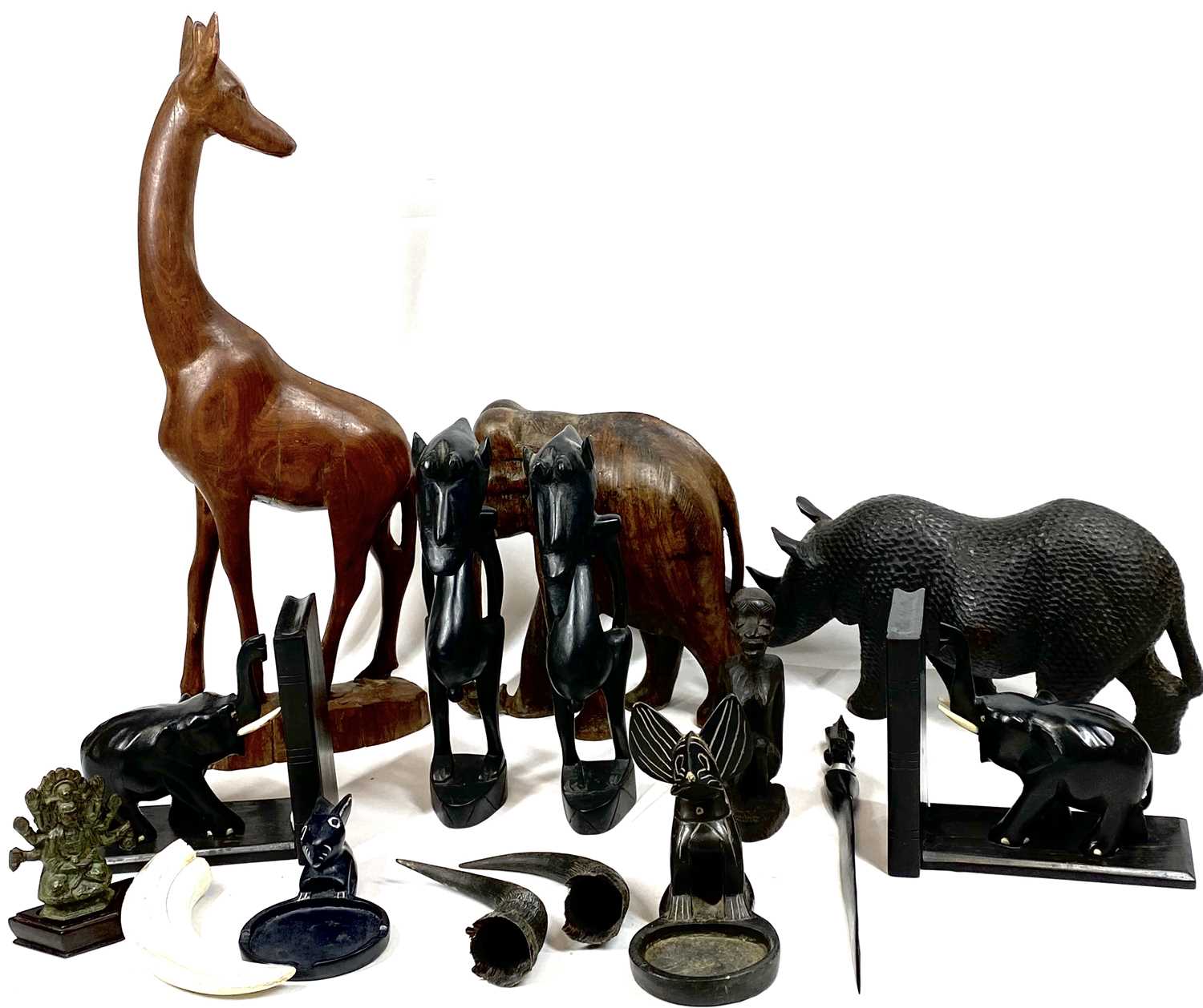 EBONY & OTHER WOODS ETHNIC CARVINGS and collectables to include a 14cms H, 35cms L rhinoceros, ebony